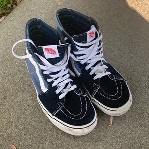 dark blue and light blue high top vans.